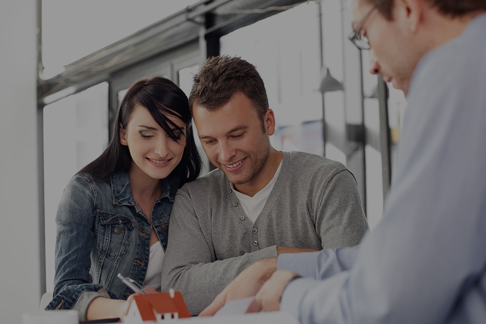 At what point should I engage a lawyer when buying or selling property?